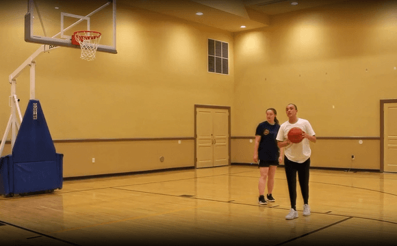 Coach Dara Mabrey leading an instruction film